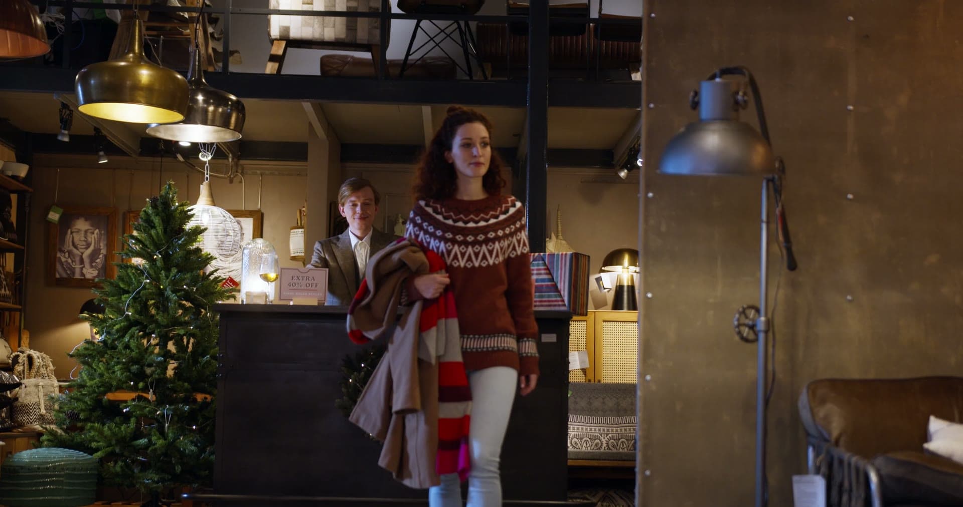 The warmly lit interior of M & M Antiques, shelves packed with vintage treasures